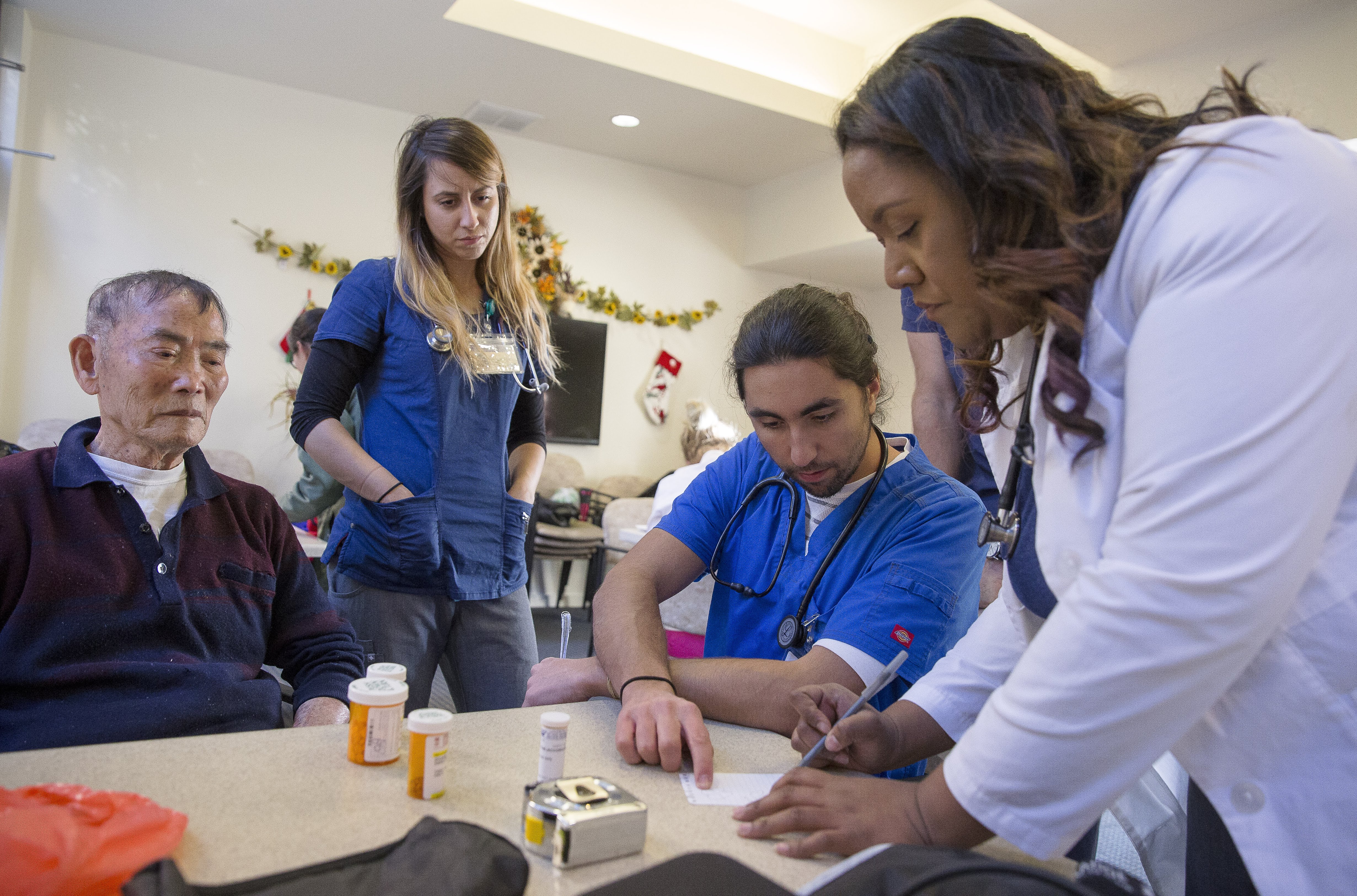 Nurses work with patients