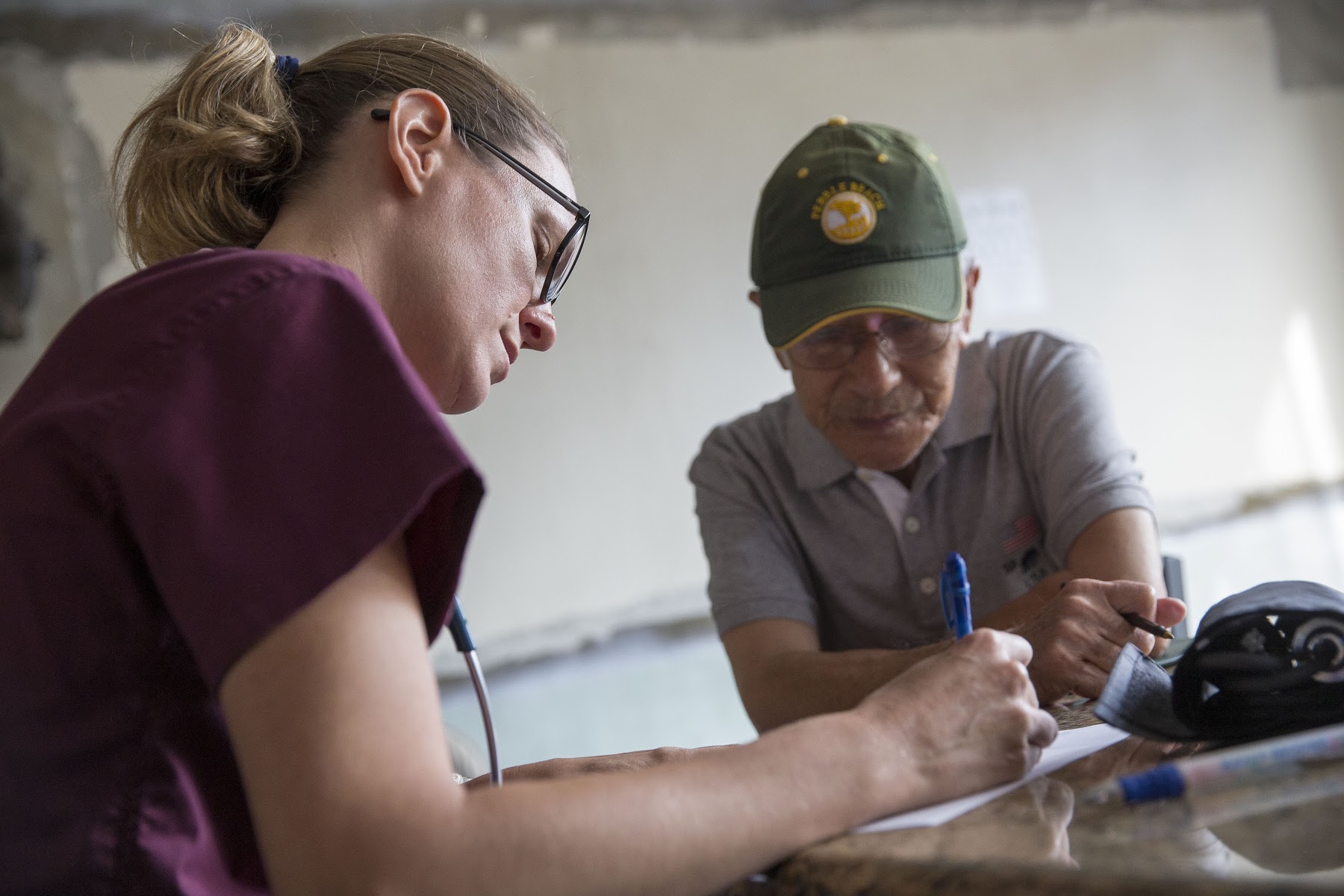 A nursing student with an elderly patient