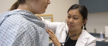 Nursing student with a patient 